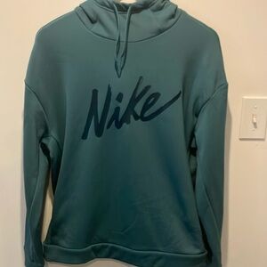 Nike teal colored woman’s hoodie with pockets. Size medium.